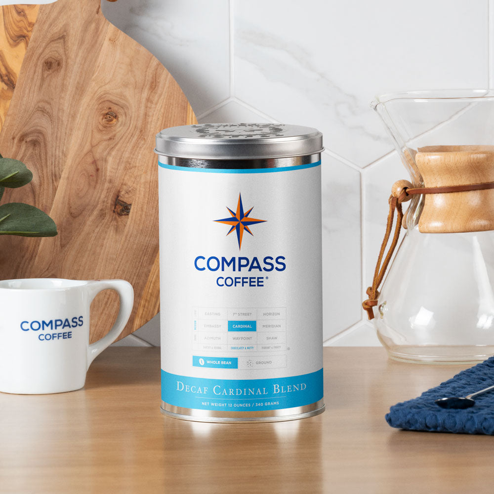 http://www.compasscoffee.com/cdn/shop/products/compass-coffee-decaf-cardinal-medium-roast-whole-bean-coffee-blend-12oz-scene.jpg?v=1673821957