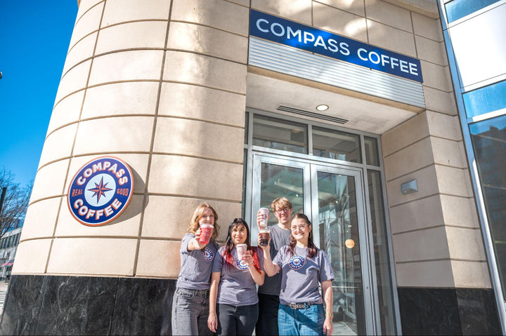 Compass Coffee Baristas in front of Clarendon cafe